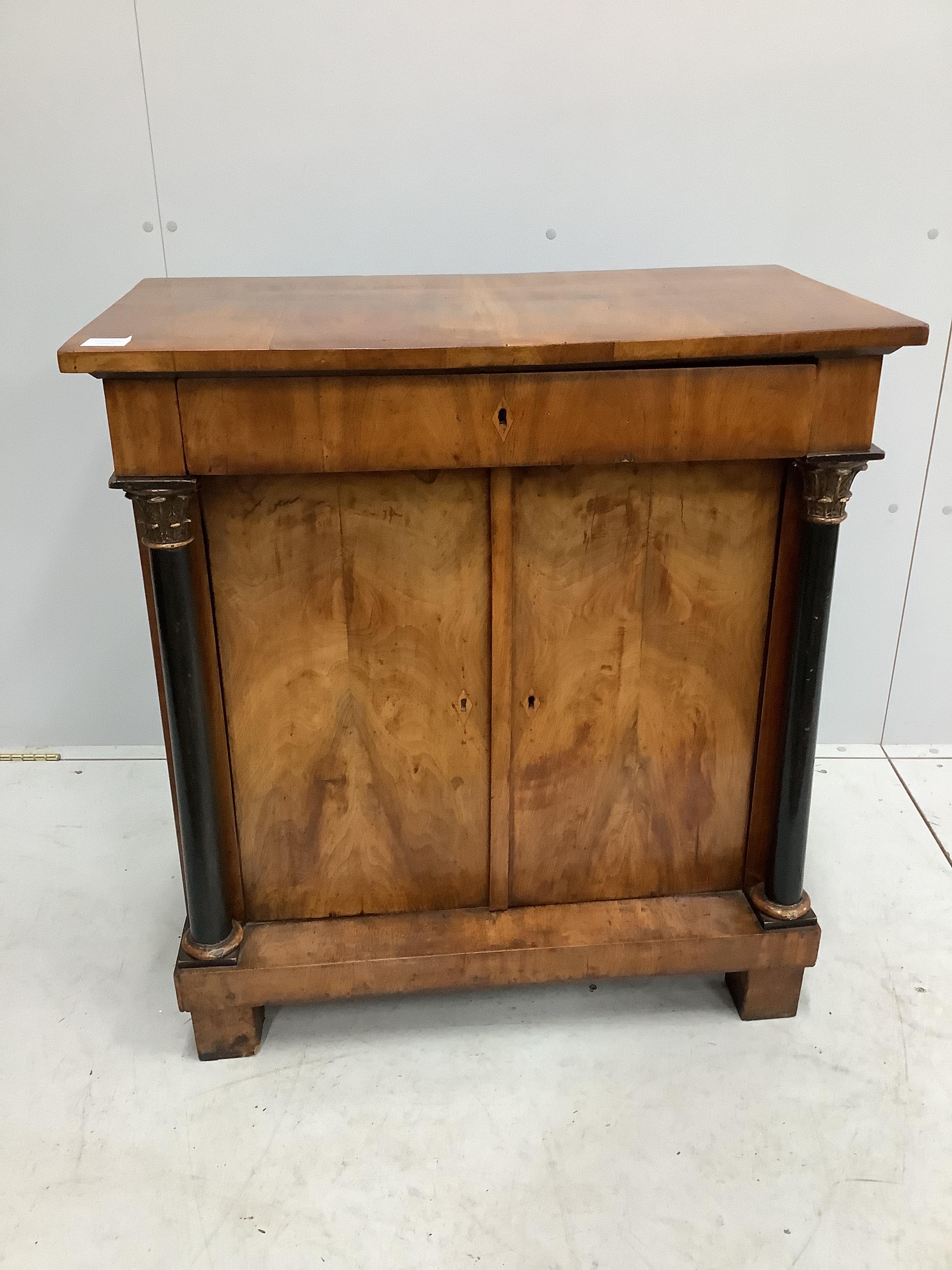 An early 19th century Biedermeier walnut side cabinet, width 82cm, depth 47cm, height 89cm